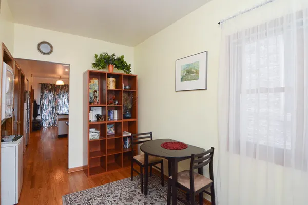 a view of a livingroom with furniture and wooden floor