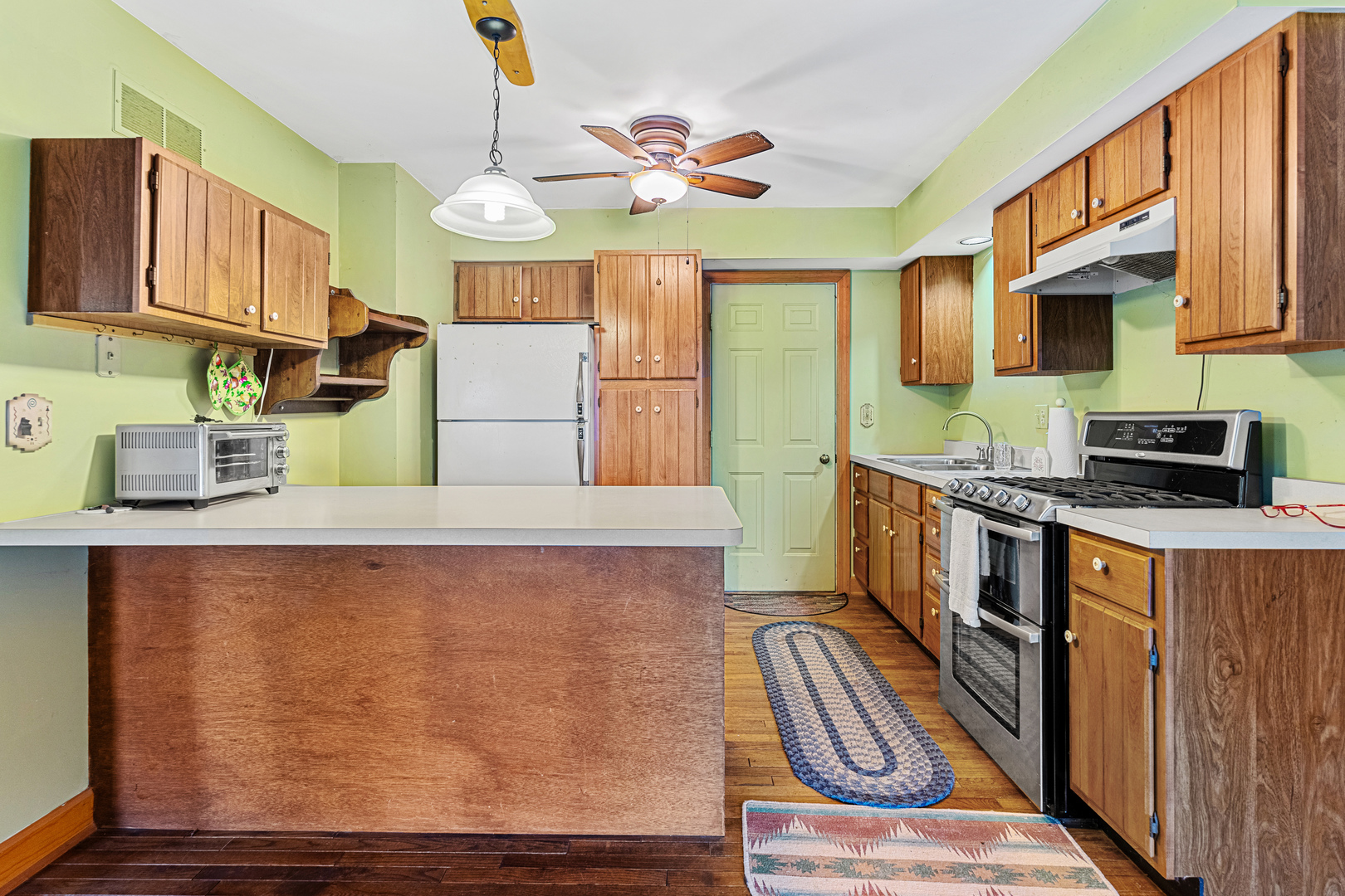 10901 Gasch Road Harvard, IL 60033 - Photo 21 of 46 a kitchen with stainless steel appliances granite countertop a stove and a sink