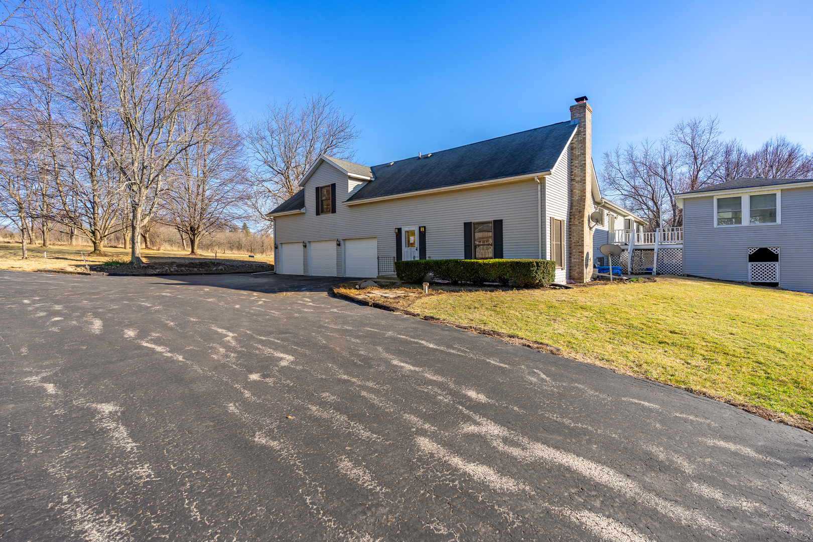 10901 Gasch Road Harvard, IL 60033 - Photo 27 of 46 a view of a house with snow on empty road