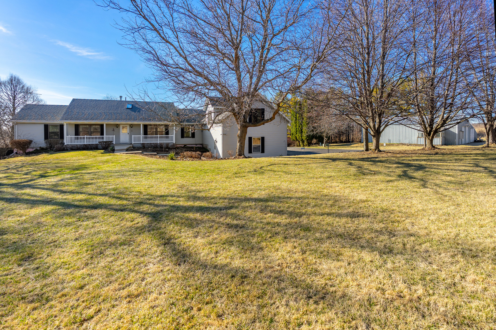 10901 Gasch Road Harvard, IL 60033 - Photo 37 of 46 a big house with trees in front of it