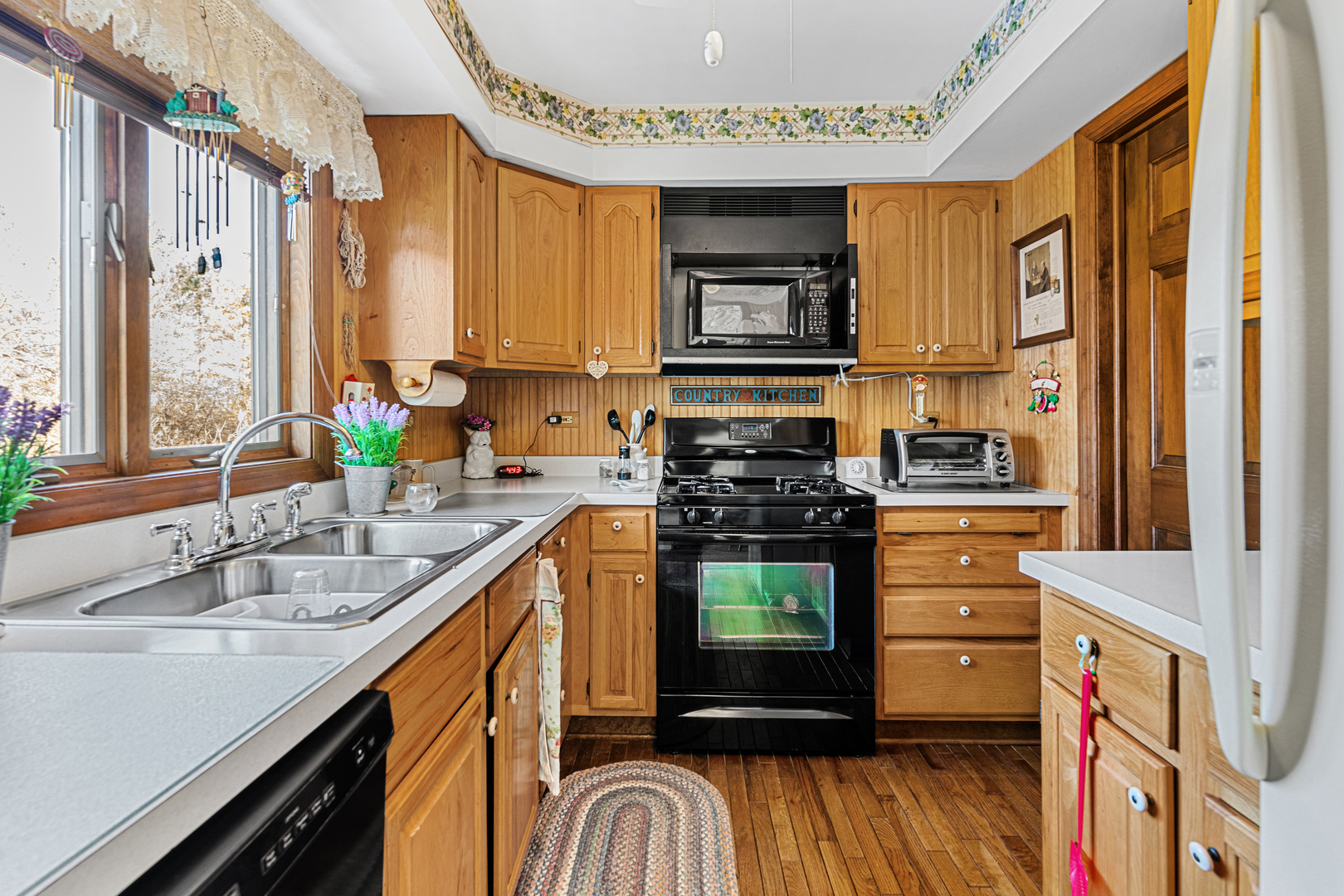 10901 Gasch Road Harvard, IL 60033 - Photo 7 of 46 a kitchen with stainless steel appliances a sink and a stove