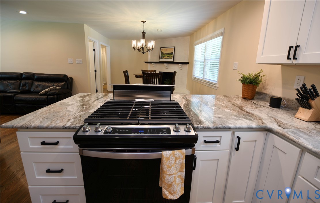 1448 Canterbury Road St. Stephens Church, VA 23148 - Photo 18 of 57 Open-concept living space featuring wood-finish fl