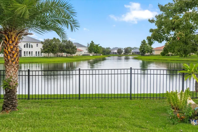 a view of lake with a yard