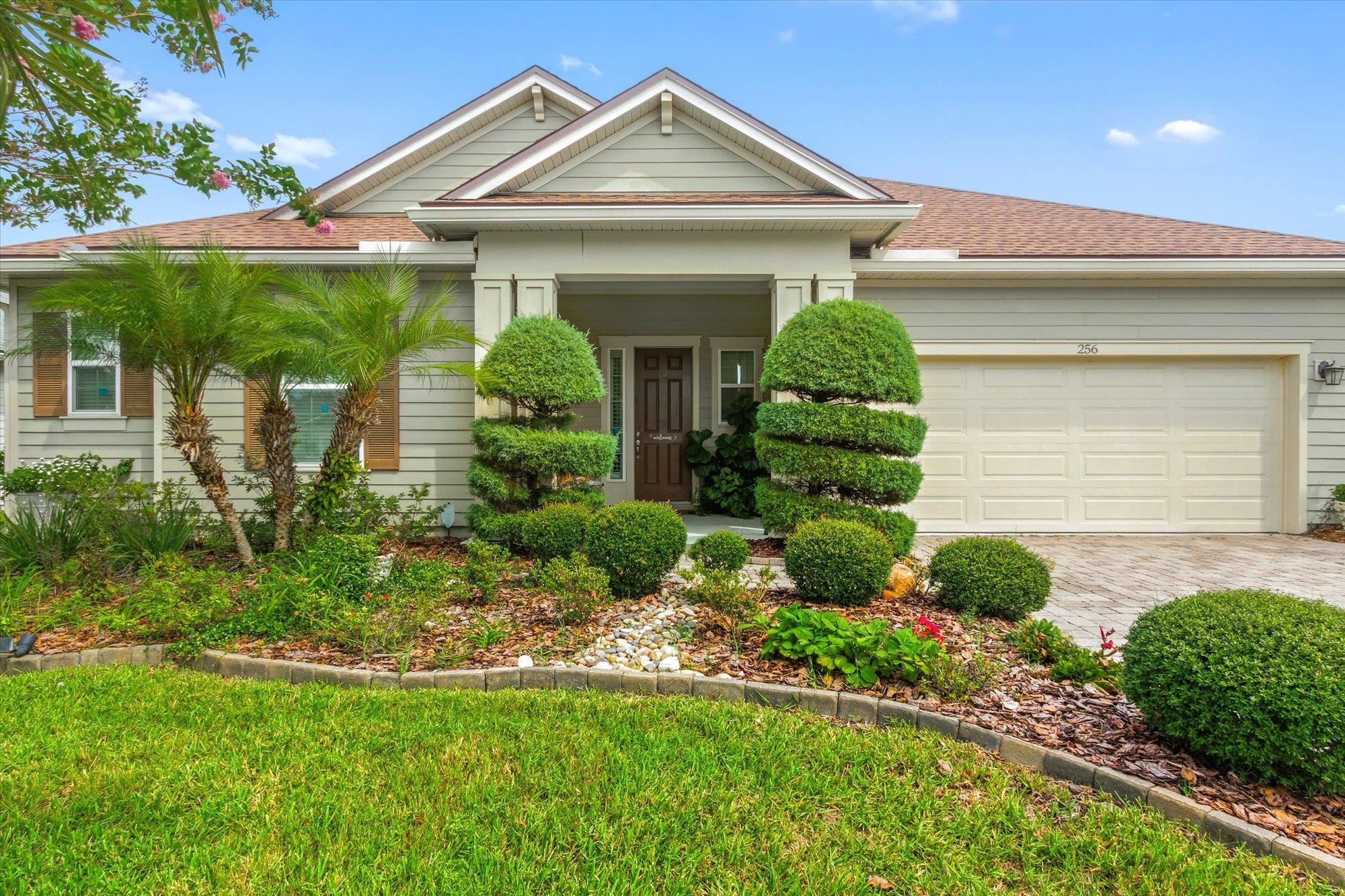 256 Vivian James Drive St. Augustine, FL 32092 - Photo 2 of 57 a front view of a house with garden