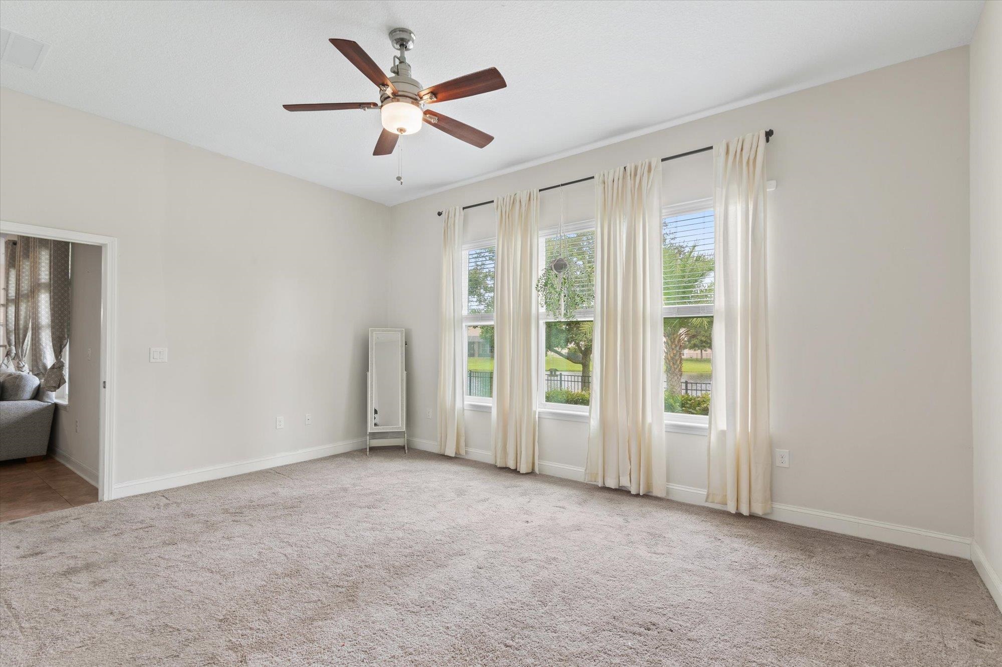 256 Vivian James Drive St. Augustine, FL 32092 - Photo 26 of 57 a view of an empty room with a window