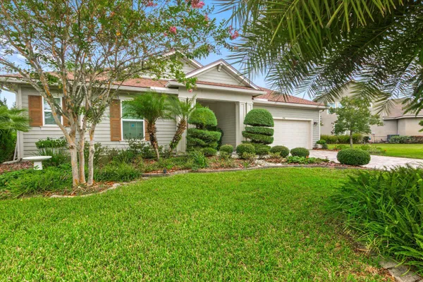 a front view of house with yard and green space