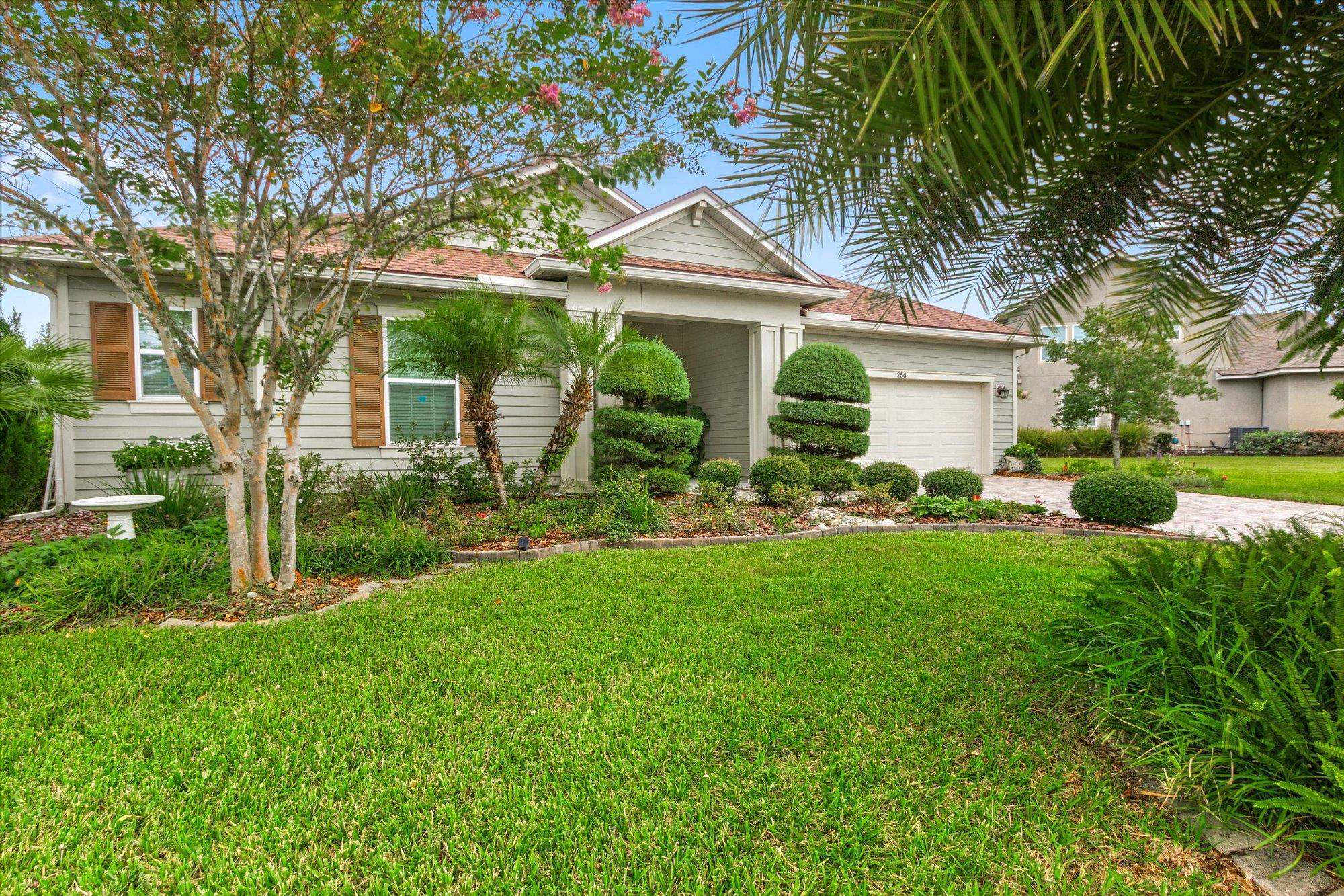256 Vivian James Drive St. Augustine, FL 32092 - Photo 3 of 57 a front view of house with yard and green space