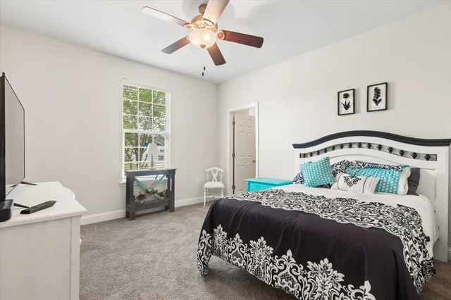 a bathroom with a sink mirror and toilet