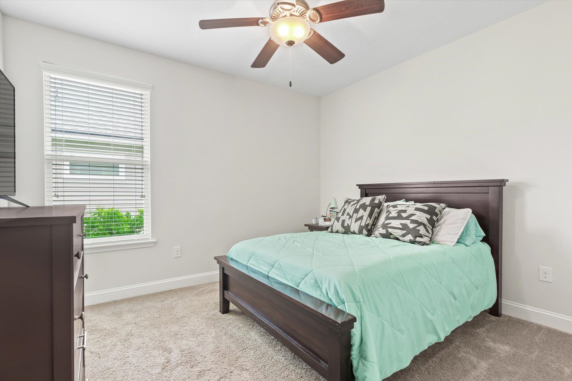 256 Vivian James Drive St. Augustine, FL 32092 - Photo 37 of 57 a bedroom with a bed and window