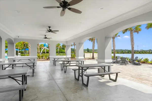 an aerial view of a house with outdoor space and lake view
