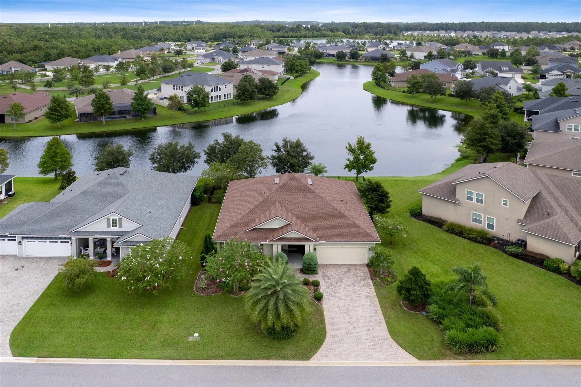 256 Vivian James Drive St. Augustine, FL 32092 - Photo 51 of 57 an aerial view of a house with outdoor space and lake view