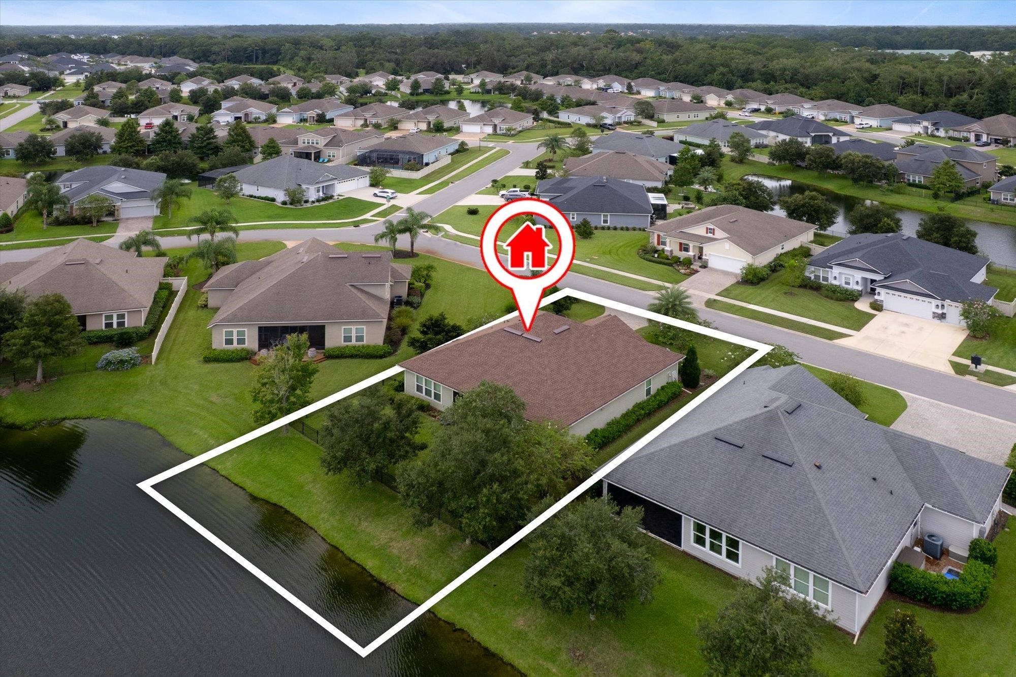 256 Vivian James Drive St. Augustine, FL 32092 - Photo 54 of 57 an aerial view of a tennis ground and a cars park side of the road