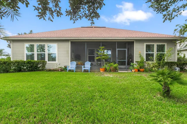front view of a house with a yard and porch