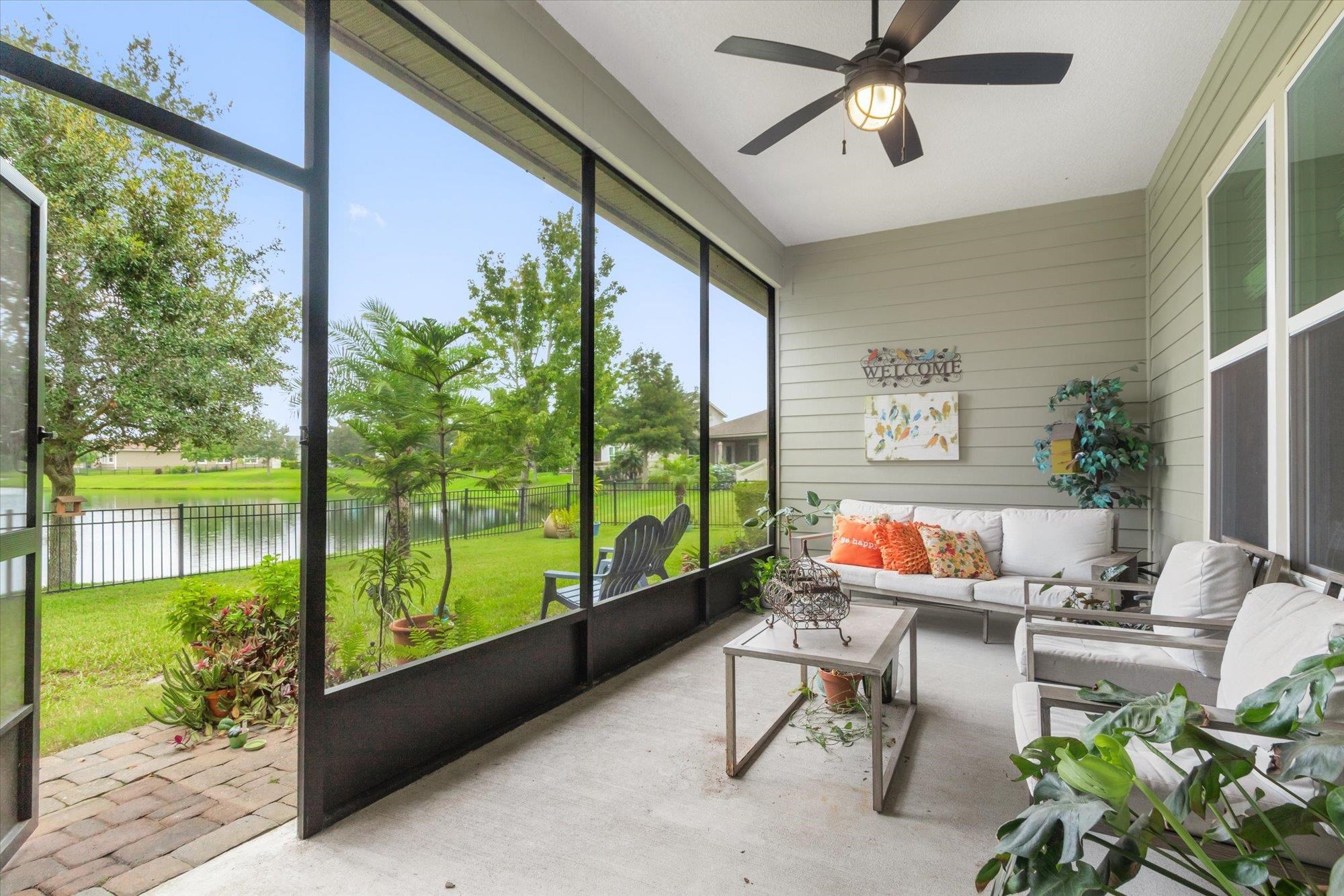 256 Vivian James Drive St. Augustine, FL 32092 - Photo 9 of 57 a outdoor space with patio the couches and a dining table with garden view