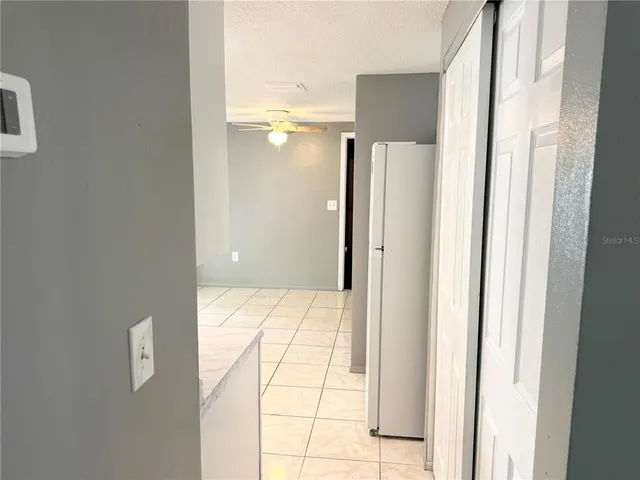 a bathroom with a glass shower door and a bathroom