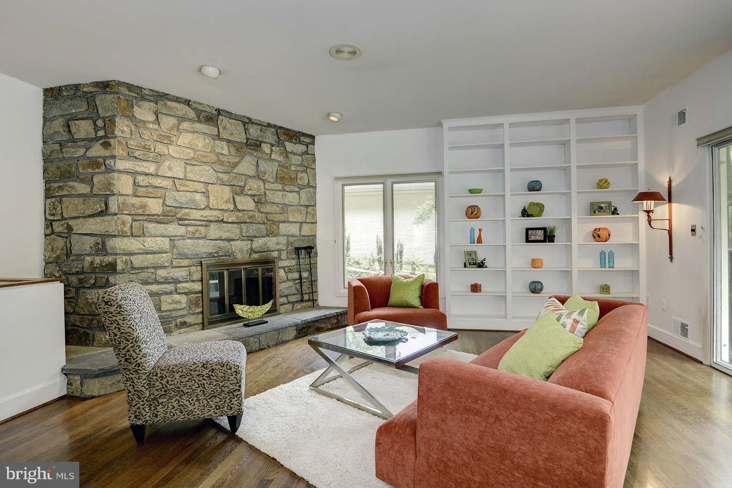 7324 Arrowood Road Bethesda, MD 20817 - Photo 13 of 30 a living room with furniture and a fireplace