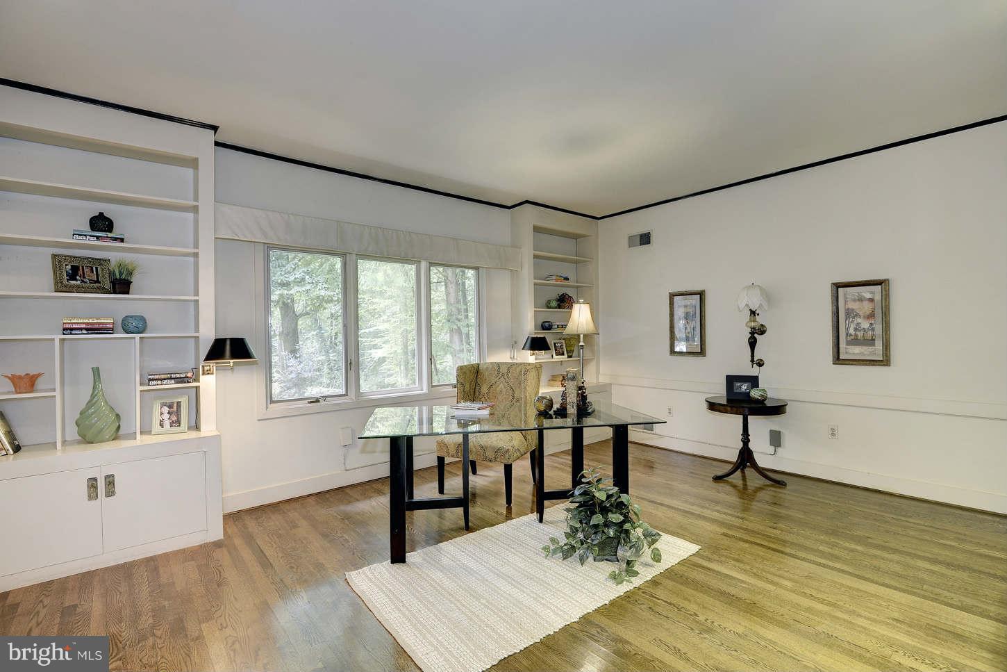 7324 Arrowood Road Bethesda, MD 20817 - Photo 14 of 30 a living room with furniture a wooden floor and next to a window