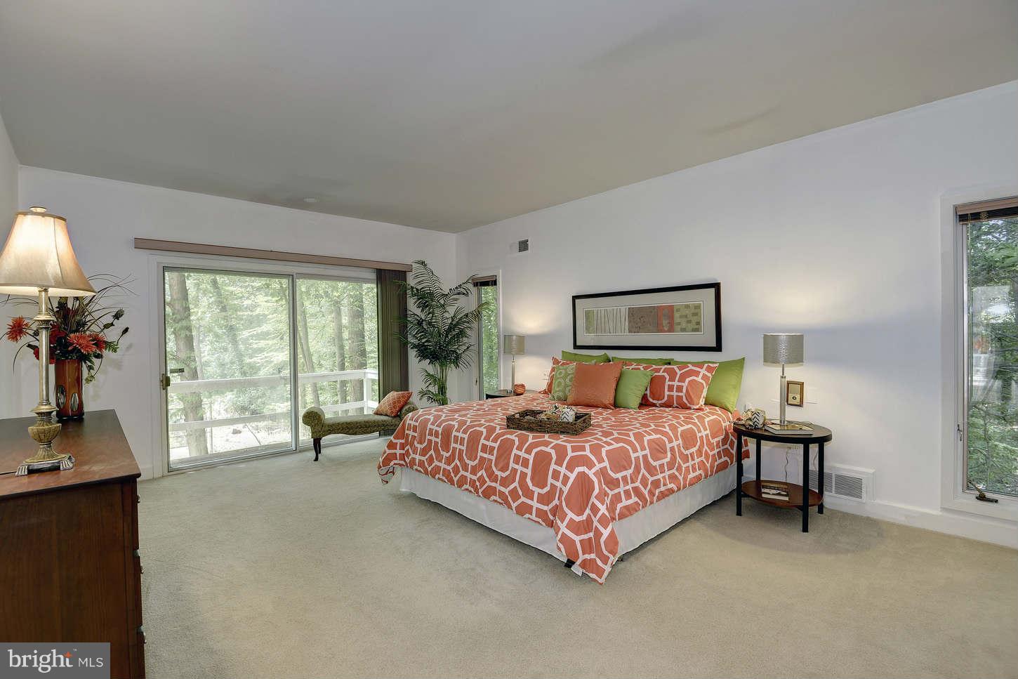 7324 Arrowood Road Bethesda, MD 20817 - Photo 16 of 30 a bedroom with a bed and a tv