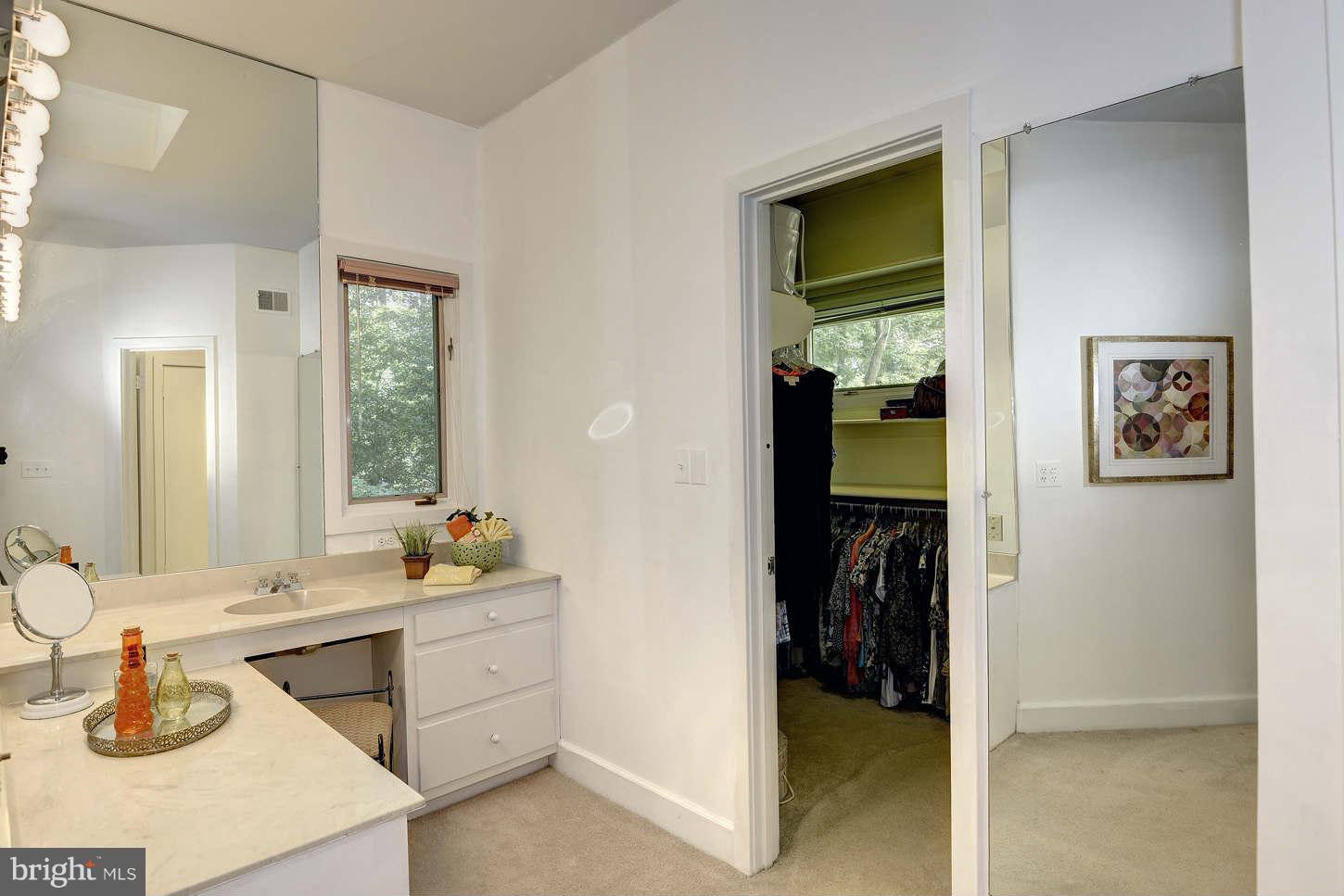 7324 Arrowood Road Bethesda, MD 20817 - Photo 18 of 30 a bedroom with a bed and a dresser