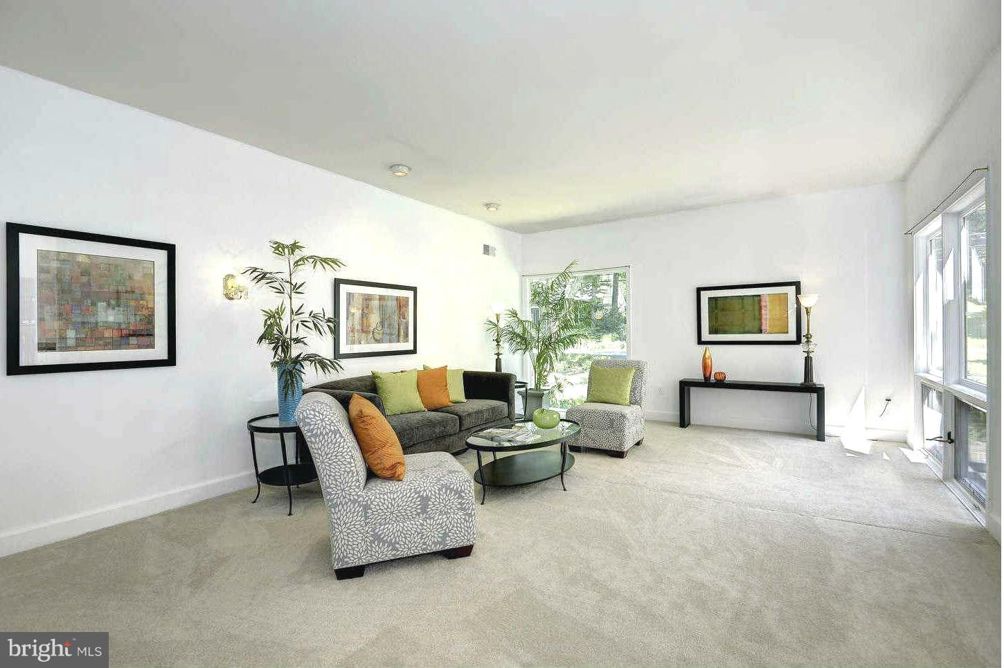 7324 Arrowood Road Bethesda, MD 20817 - Photo 8 of 30 a living room with furniture and a couch