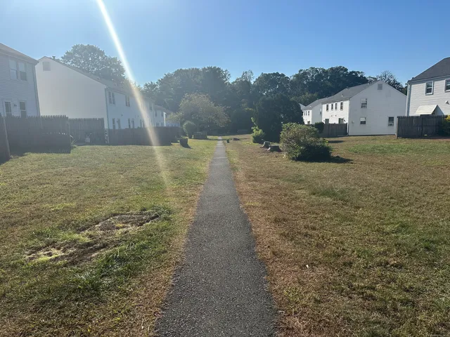 a sign that is sitting on a brick wall