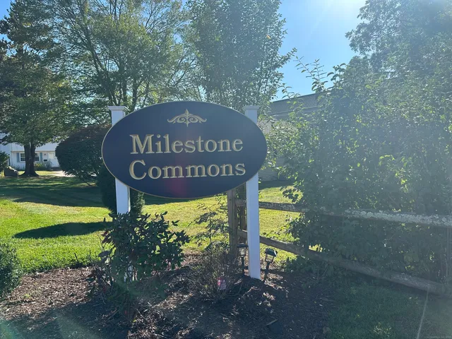 a view of a sign board with yard