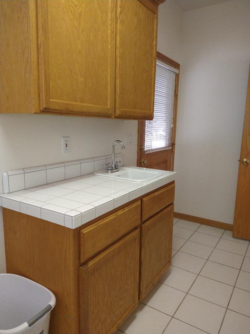 9130 Quail Lake Court Loomis, CA 95650 - Photo 13 of 31 a utility room with dryer and washer