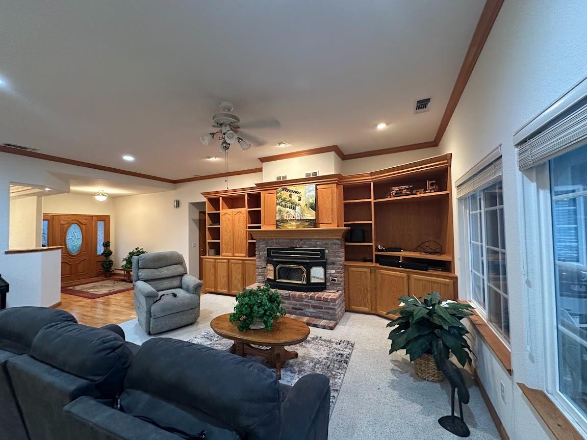 9130 Quail Lake Court Loomis, CA 95650 - Photo 14 of 31 a living room with furniture and a flat screen tv