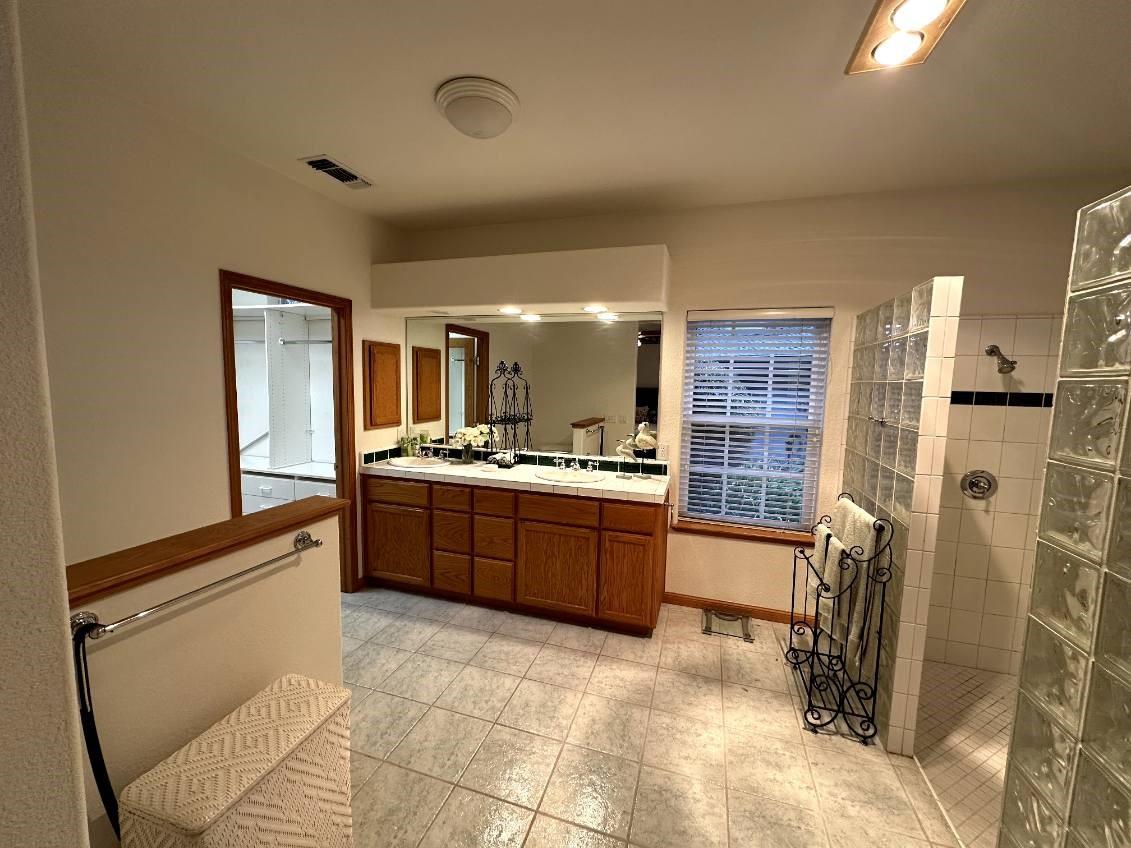 9130 Quail Lake Court Loomis, CA 95650 - Photo 20 of 31 a kitchen with stainless steel appliances granite countertop a refrigerator and a sink