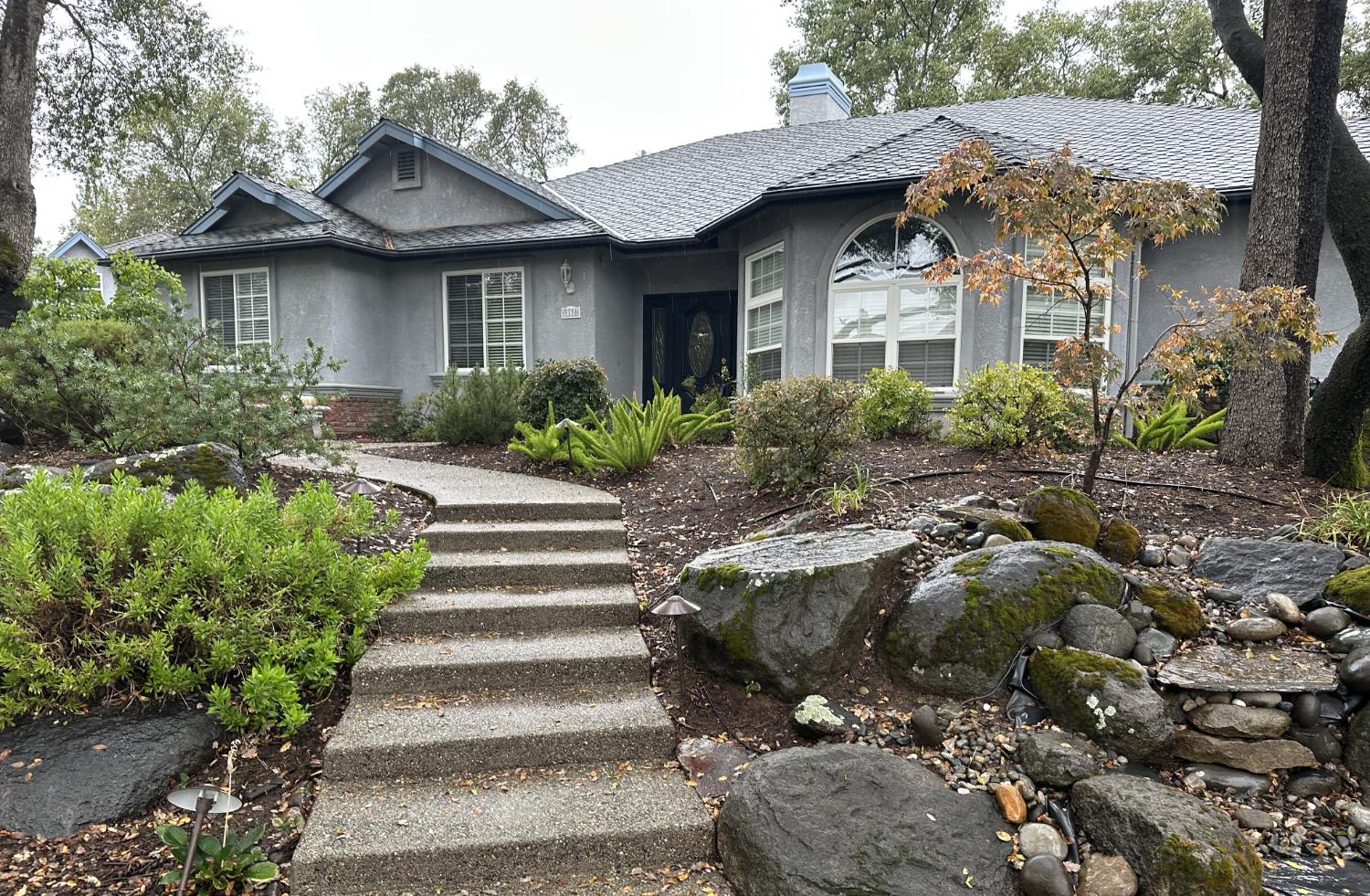 9130 Quail Lake Court Loomis, CA 95650 - Photo 2 of 31 a front view of a house with a garden