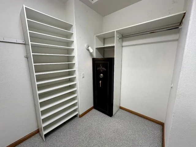 a bathroom with a double vanity sink and mirror