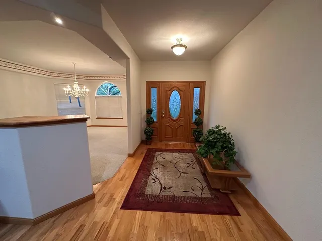 a bathroom with a sink a mirror and a shower