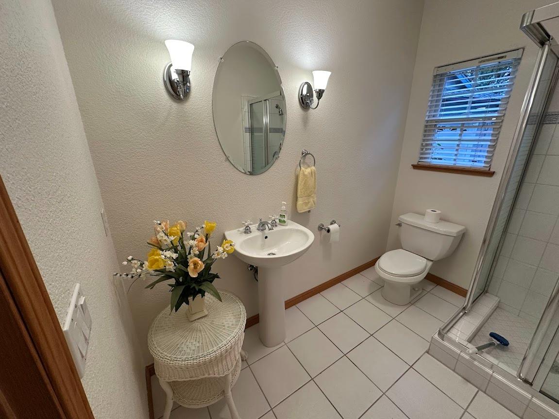9130 Quail Lake Court Loomis, CA 95650 - Photo 7 of 31 a bathroom with a toilet sink and mirror