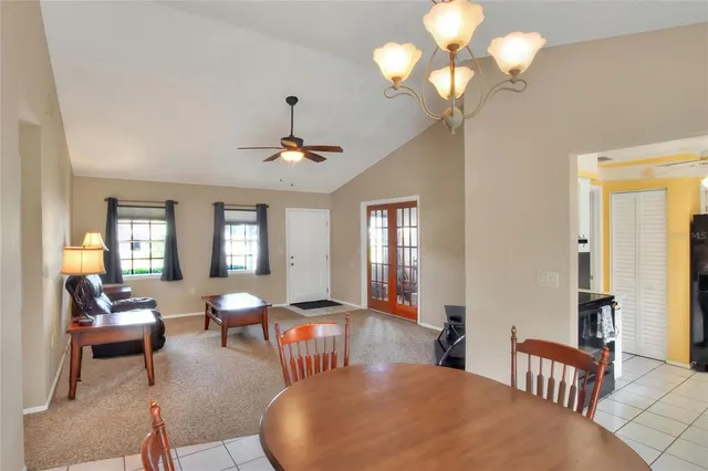 a kitchen with stainless steel appliances granite countertop a refrigerator a sink and dishwasher