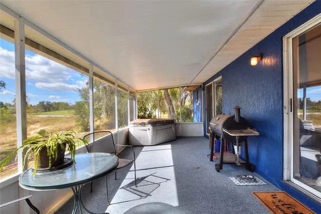 a dining room with a large window and a table