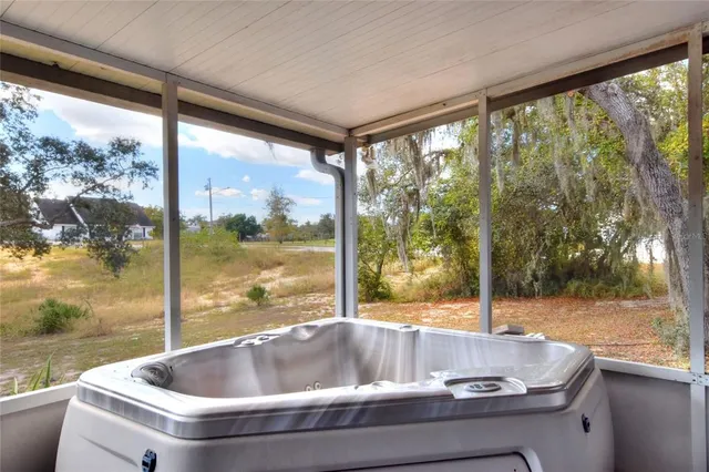 a living room with couch and a large window