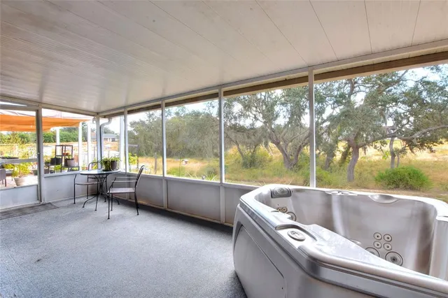 a reading room with furniture and a large window