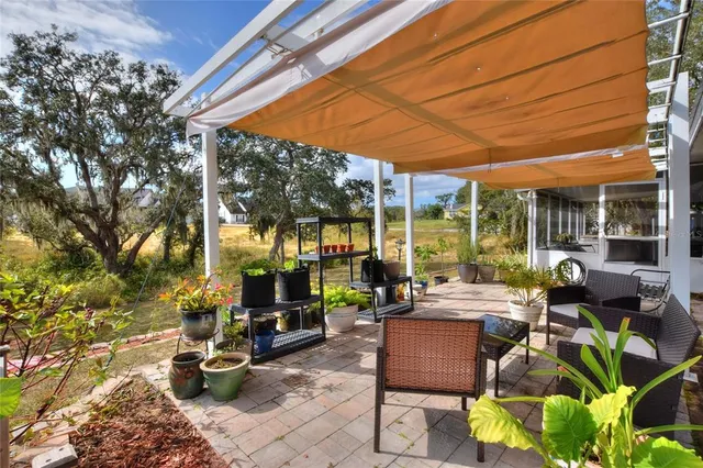 a view of swimming pool is middle in the garden