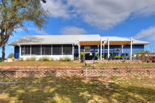 a front view of a building with a garden