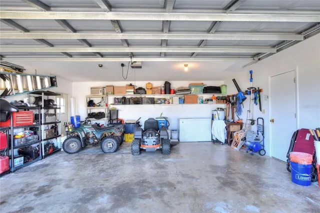 an aerial view of residential houses with outdoor space and swimming pool