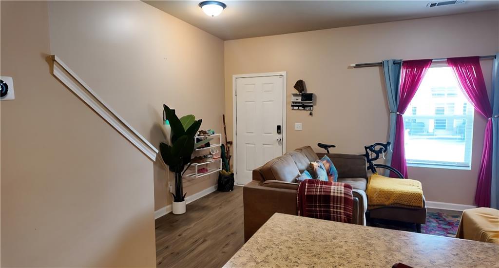 4039 Avalon Road Southwest Atlanta, GA 30331 - Photo 11 of 11 a living room with furniture a window and a flat screen tv