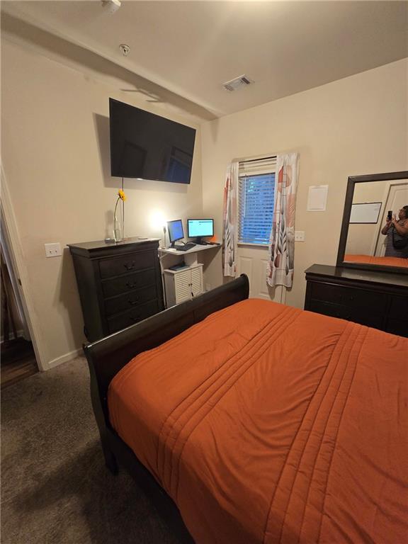 4039 Avalon Road Southwest Atlanta, GA 30331 - Photo 5 of 11 a bedroom with a bed and a flat screen tv