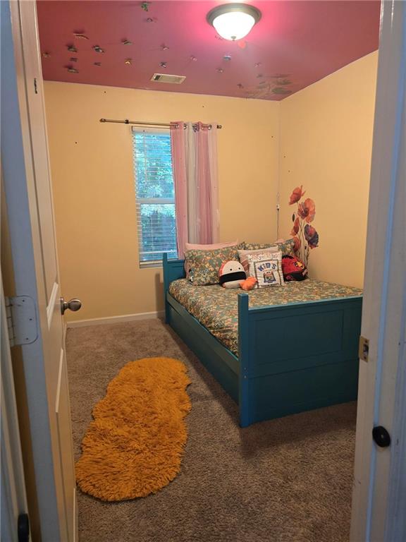 4039 Avalon Road Southwest Atlanta, GA 30331 - Photo 6 of 11 a bedroom with a bed and a window