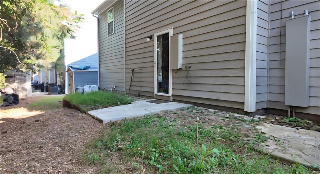 4039 Avalon Road Southwest Atlanta, GA 30331 - Photo 10 of 11 a view of a house with a yard