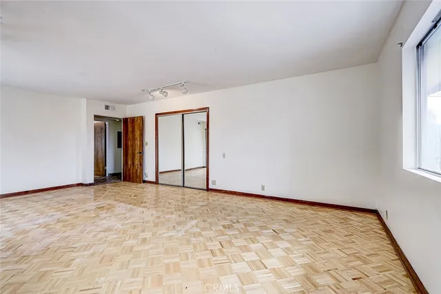 a view of an empty room with a window