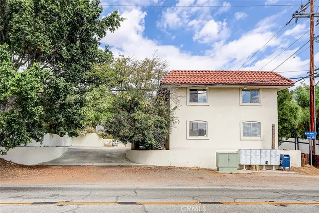 a kitchen with a stove top oven and refrigerator