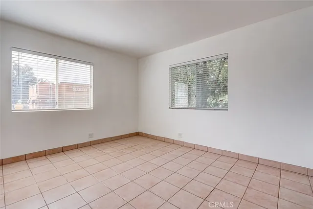 a kitchen that has a sink and a stove in it