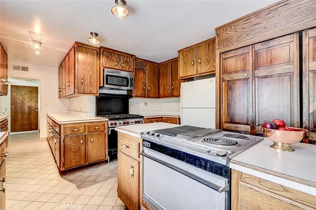a view of a room with wooden floor and window