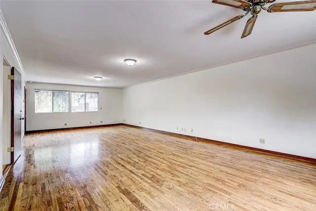 a bathroom with a granite countertop toilet sink and mirror