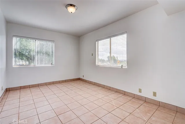an aerial view of a residential houses with outdoor space